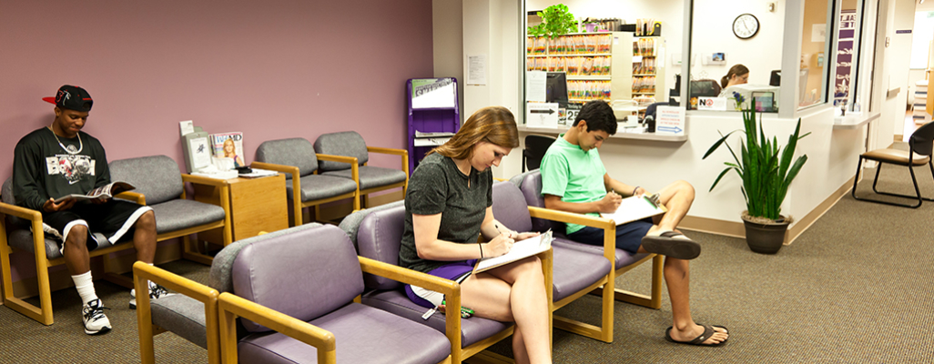 Brown Lupton Health Center Image Depicts Tcu Students Filling Out Forms In The Health Center Waiting Room